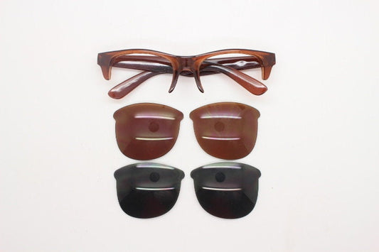 90s vintage modified wayfarer design sunglasses. Transparent brown browline half frame with brown or green interchangeable lenses . NOS