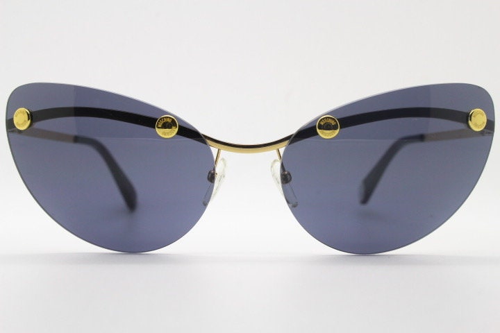 Moschino oval cat eye sunglasses model 082/S. Womens frameless cateye in perfect proportions with golden metal brow line
