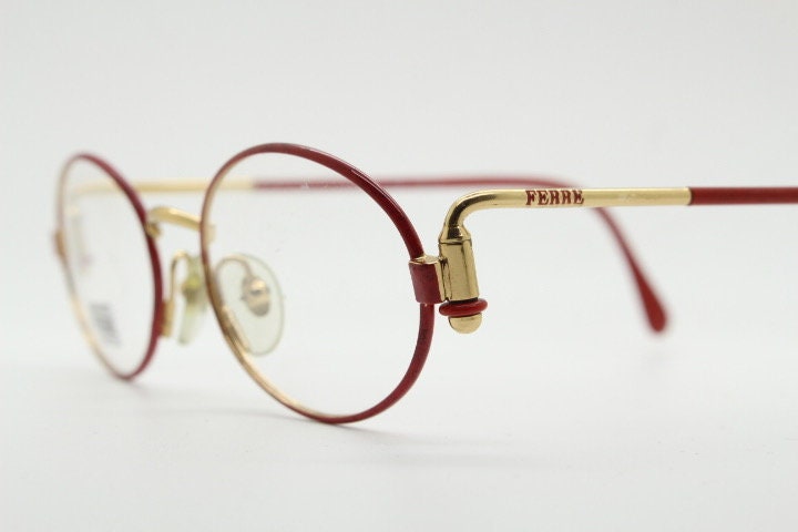 Gianfranco Ferre 90s vintage oval eye glasses made in Italy. Red and gold metal tech design optical frame. Prescription RX. NOS