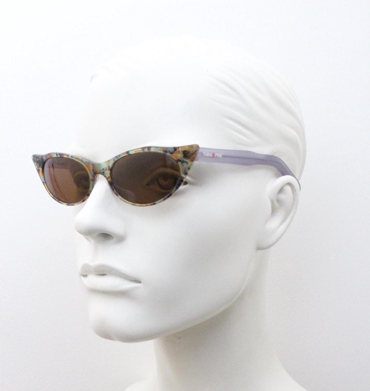 90s vintage extreme pointed cat eye sunglasses made in Italy. Multi colour marble front with lilac arms. Acetate cateye. NOS. Rockabilly