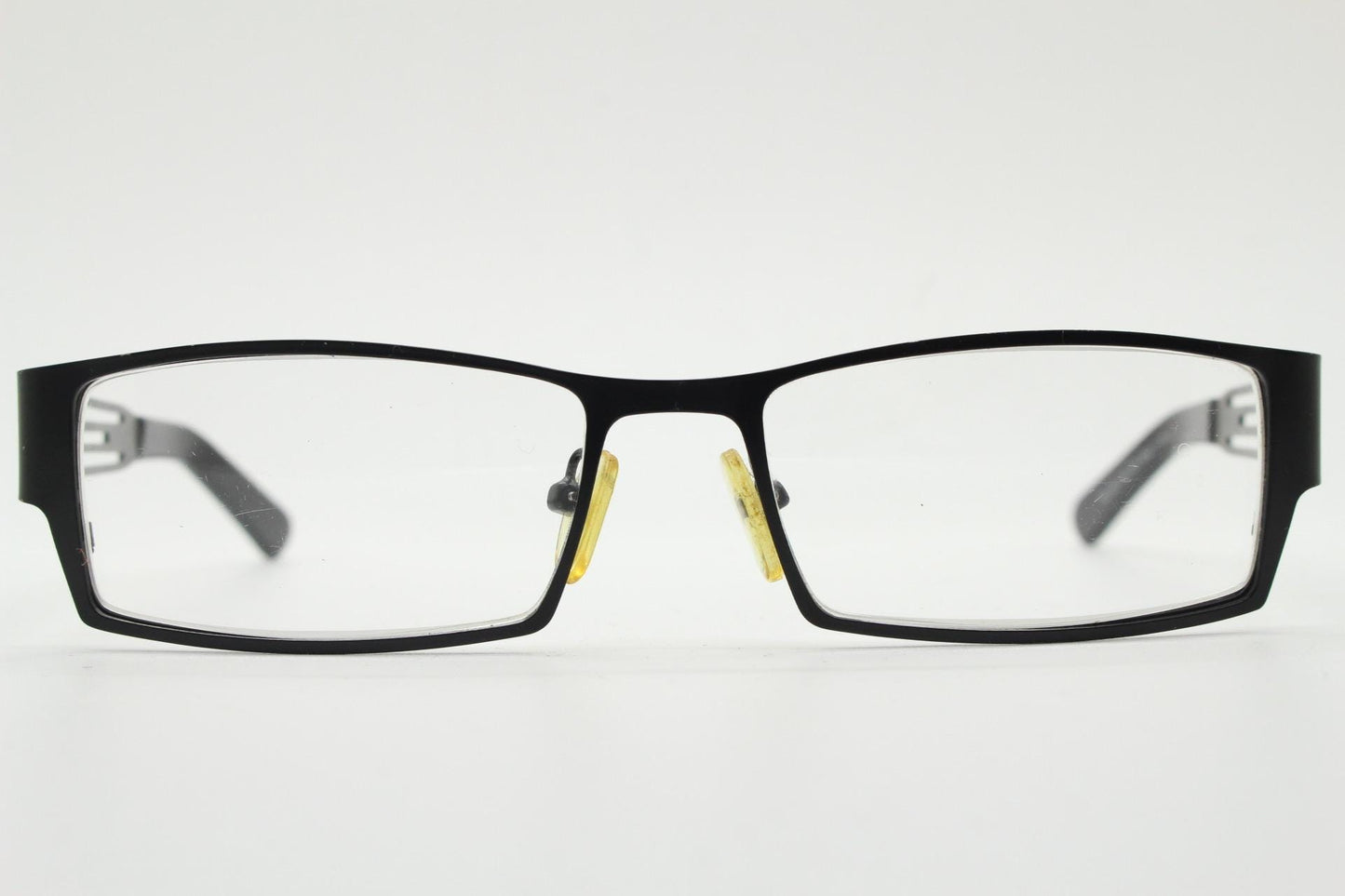 Police 90s vintage rectangular eye glasses model 023. Solid metal optical frame in black satin finish with cut out arm stripes. Prescription
