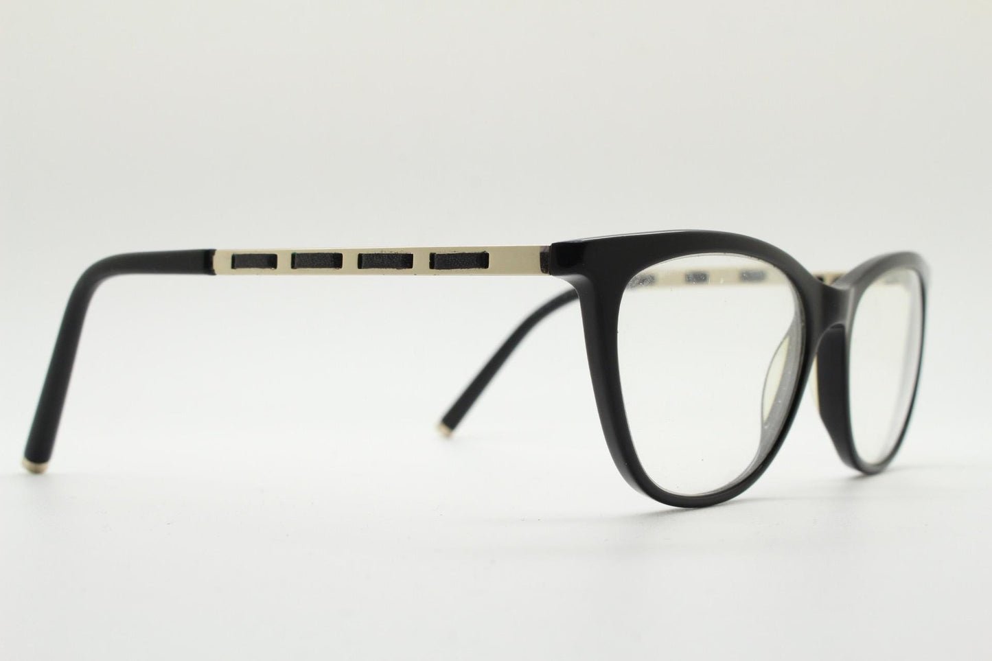 Vintage elegant cat eye glasses by Heritage. Black gloss acetate optical frames with leather lattice arms. Prescription RX cateye spectacles