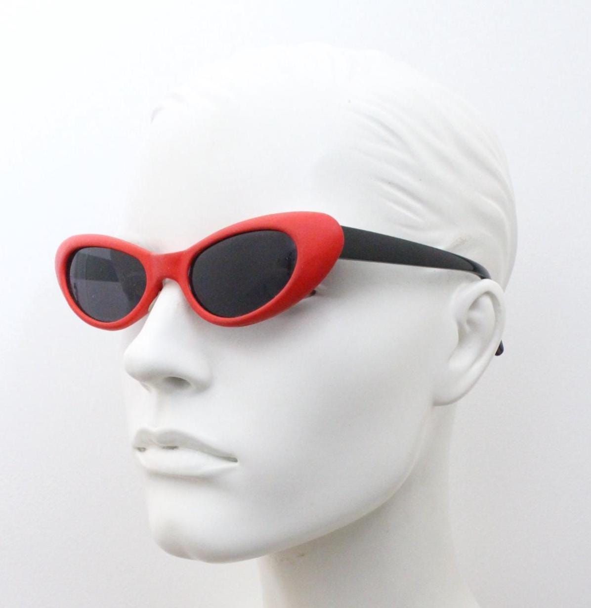 Vintage 80s oval cat eye sunglasses. Dynamic red rubber front with black gloss arms. Hyper real cosplay cateye. New wave punk