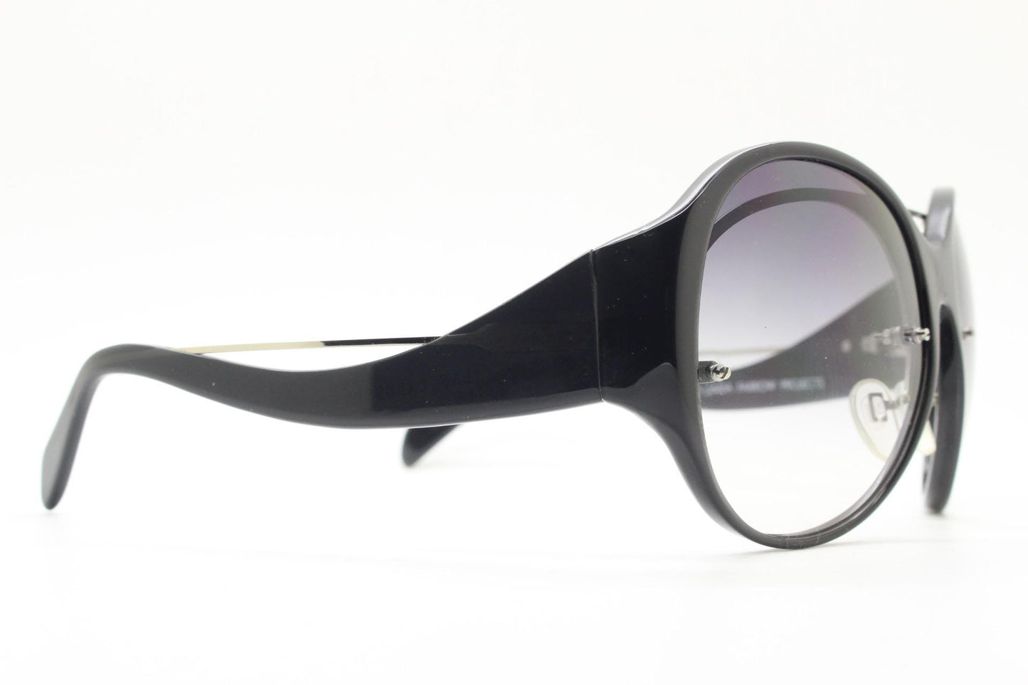 Jens Laugesen oversized sunglasses hand made by Linda Farrow. Black frame with undulating arms and smoky lenses. 70s design. Vintage. NOS