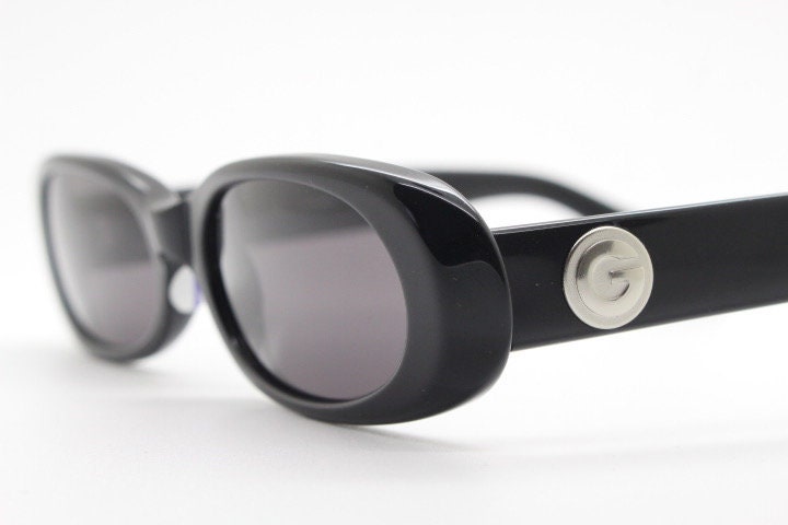 Guess vintage 90s low profile oval sunglasses. All black gloss quality acetate finish. New Old Stock