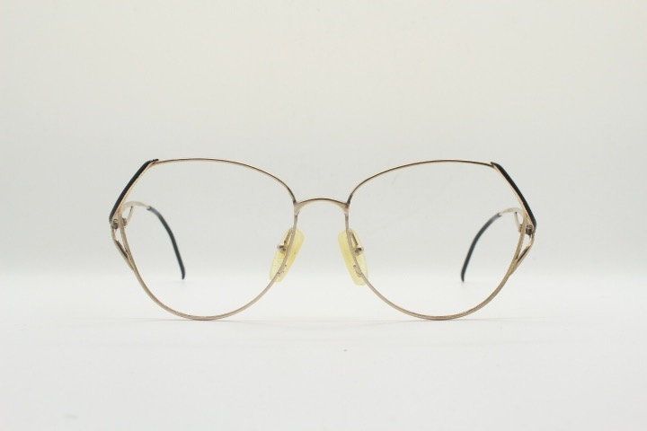 Viennaline 70s vintage angular round eye glasses. Slightly oversized subtle gold chrome optical frame with incredible arms. Prescription RX