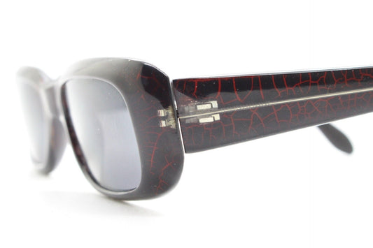 90s authentic vintage abstract rectangular sunglasses. Thickened black frame with red crackle print. NOS