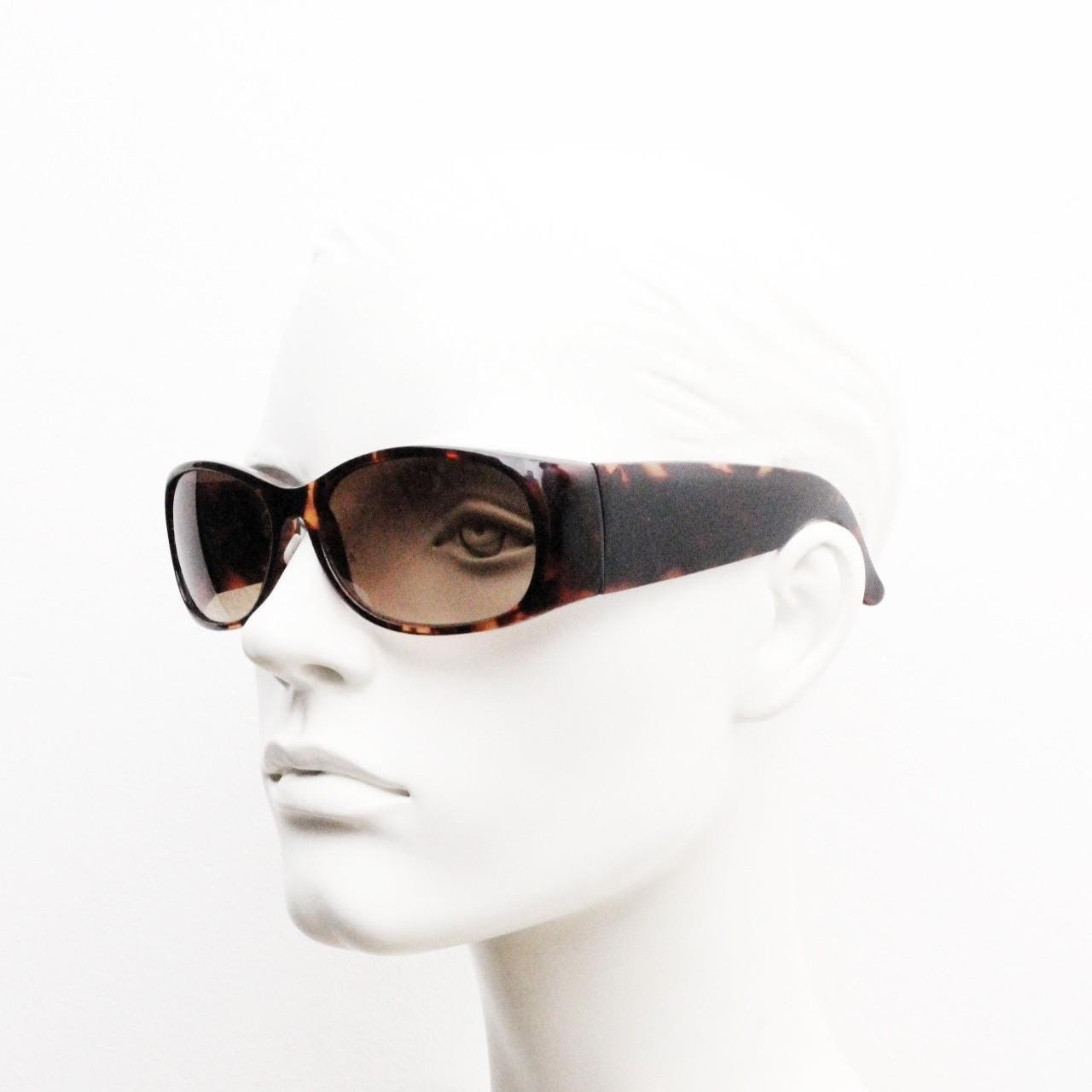 Y2k vintage wrap around bug eye sunglasses. Aerodynamic 60s design tortoise frame with full height arms in excellent proportions. 2000's NOS