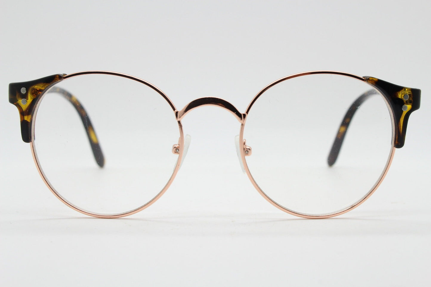 90s vintage modified cat eye glasses. Tortoise arms with a round gold face. 40s, 50s style clear lens eyeglasses. Cateye