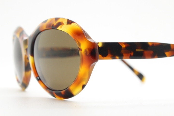 Francois Pinton Paris 90s vintage oval sunglasses made in France. Womens thick acetate frame in brown and amber tones. NOS