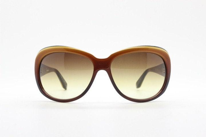 Dita oversized 70s design sunglasses model Pretender made in Japan. Gorgeous brown and black layered acetate. Womens NOS. 60s