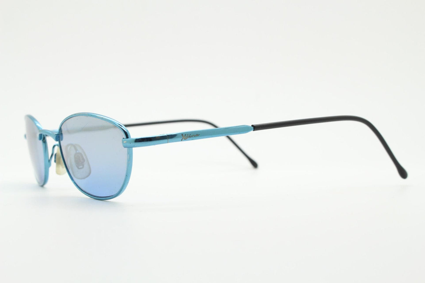 90s vintage small oval sunglasses by X-line. Unusual blue chrome metal frame with well matched mirror lenses. Quality NOS
