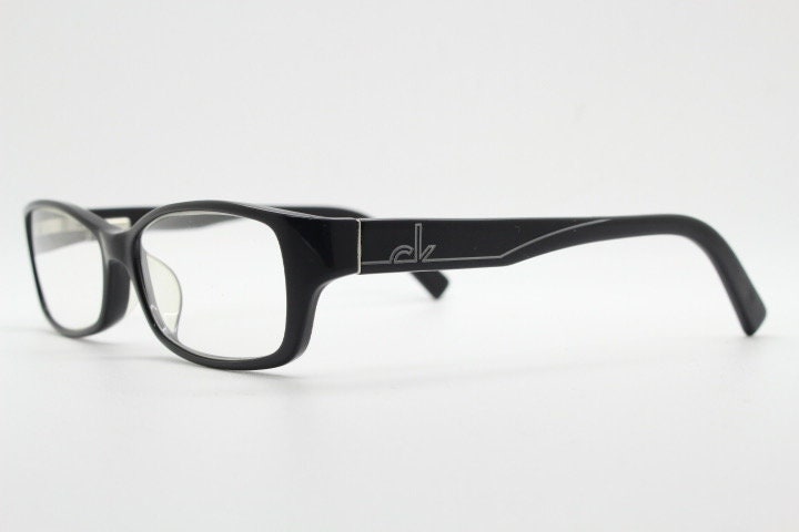 Calvin Klein rectangular glasses model 5714. Black gloss low profile acetate optical frames. Prescription eyeglasses. RX vintage spectacles