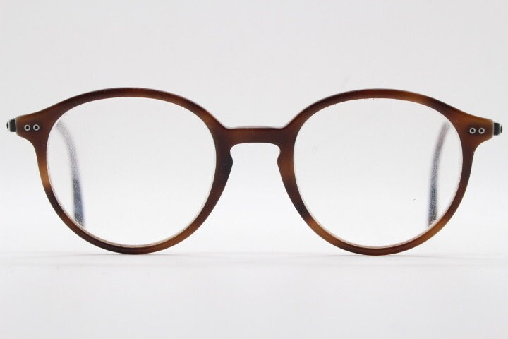Giorgio Armani eye glasses model 7124 made in Italy. Mottled brown acetate optical frames with flat metal arms. Prescription eyeglasses. RX