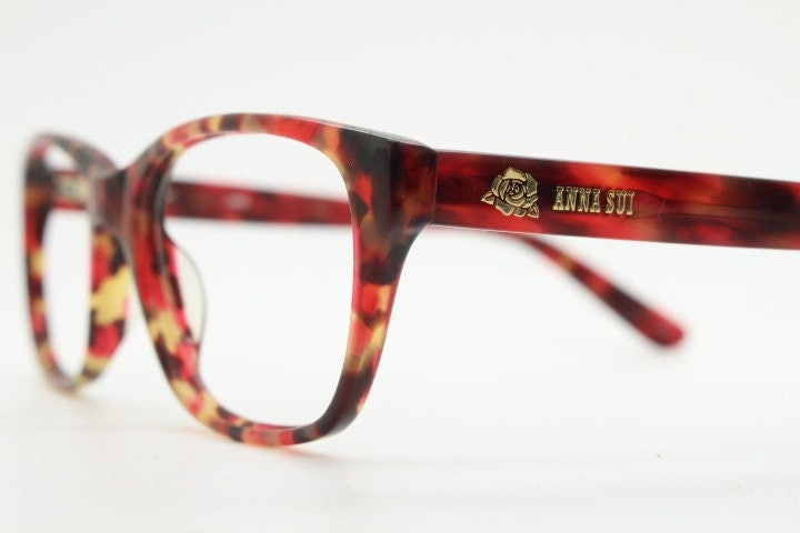 Anna Sui modified wayfarer design eye glasses. Superb marbled acetate optical frames with red tones. Prescription RX vintage eyeglasses