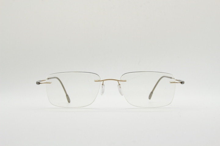 Silhouette rectangular frameless eye glasses model 7719 made in Austria. Minimal lightweight titanium optical frame. Prescription RX