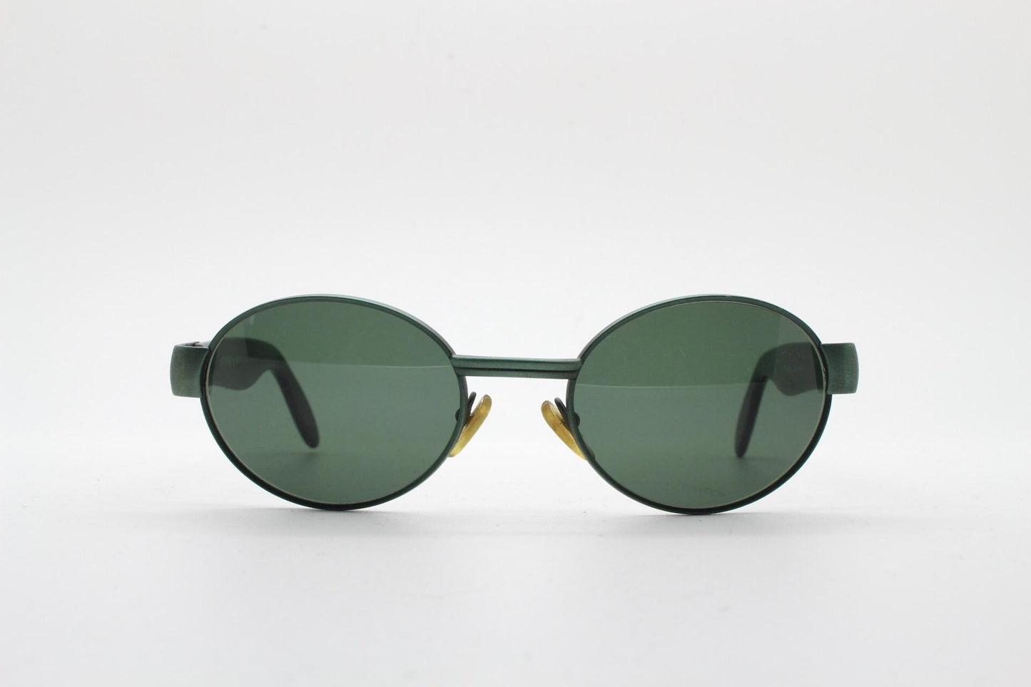 Safilo for Oxydo 90s vintage oval sunglasses made in Italy. Green matt finish solid metal frame with black arms and green lenses. Unused NOS