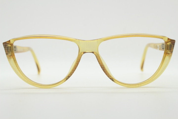 Christian Dior 80s vintage flat top cat eye glasses made in Germany. Transparent yellow optical frame with abstract print. Prescription RX