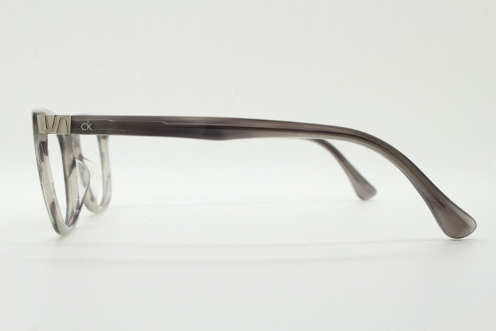 Calvin Klein rectangular eye glasses. Unisex transparent grey gloss acetate optical frames. Prescription eyeglasses. RX spectacles