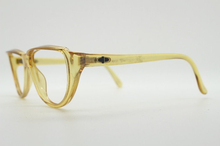 Christian Dior 80s vintage flat top cat eye glasses made in Germany. Transparent yellow optical frame with abstract print. Prescription RX
