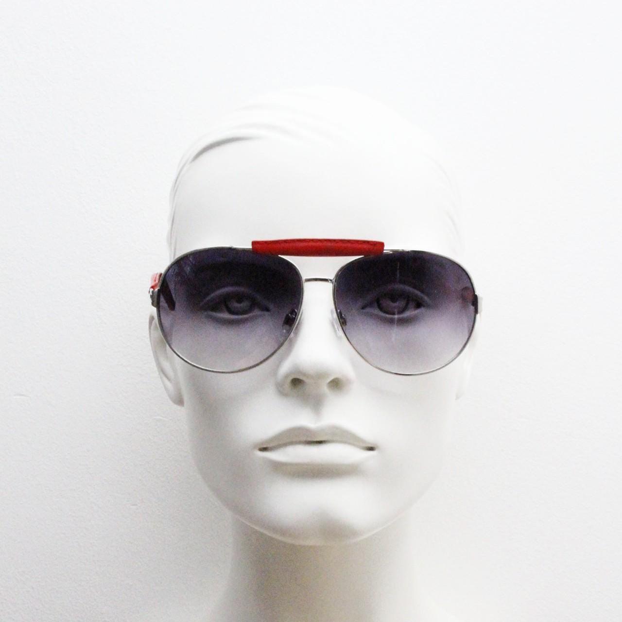 Y2K vintage aviator sunglasses. 2000's silver metal frame with exaggerated bridge in red trim. 70s racing design. 00's NOS aviators