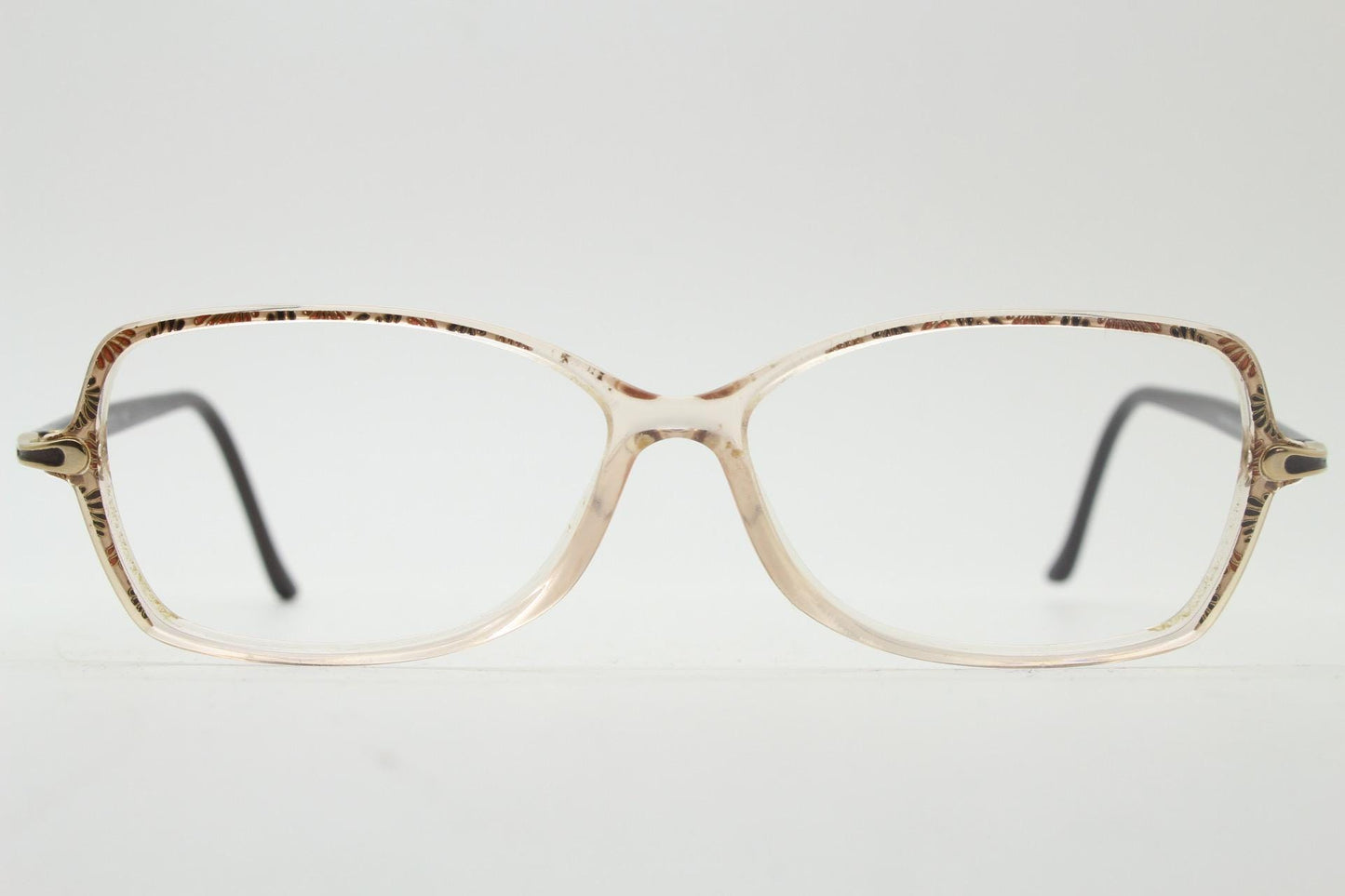 Silhouette 80s vintage oval eye glasses made in Austria. Transparent crystal optical frame with giraffe arm print. Prescription RX