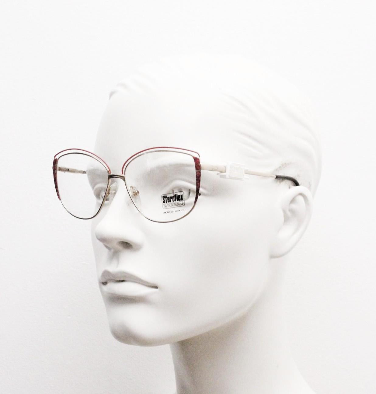 Luxottica 80s vintage gold metal eye glasses made in Italy. Inventive double brow with red highlights. Optical frame. Prescription NOS