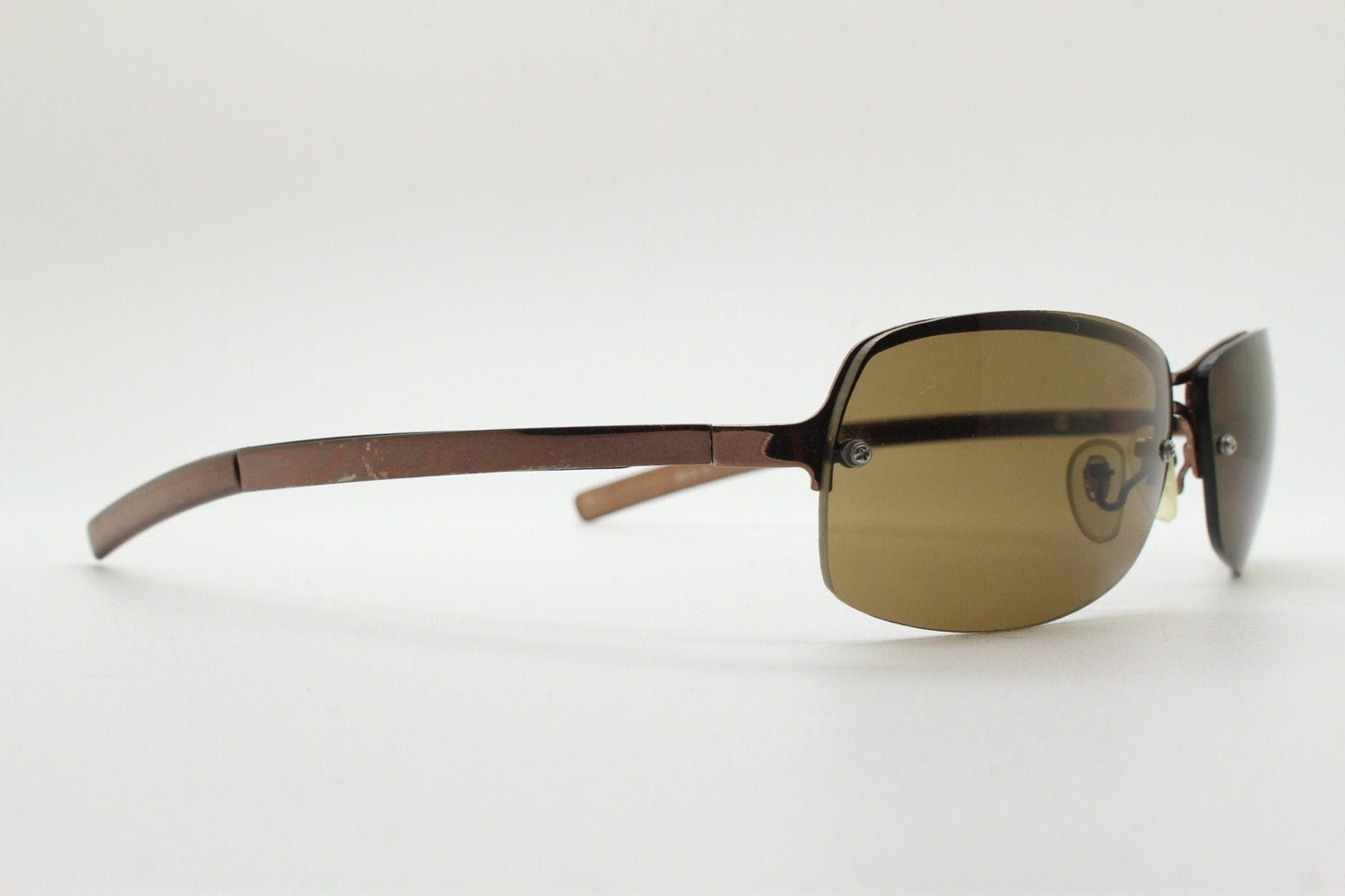 Y2K vintage modified small aviator sunglasses. Metallic brown chrome half frame with curved bug eye lenses and straight arms. 2000's. NOS