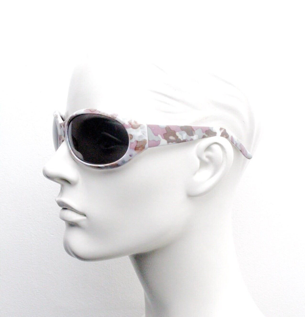 Y2k vintage curved camouflage pattern sunglasses. Wrap around bug eye 60s style shield frame with unbelievable cammo print. 2000s unused NOS