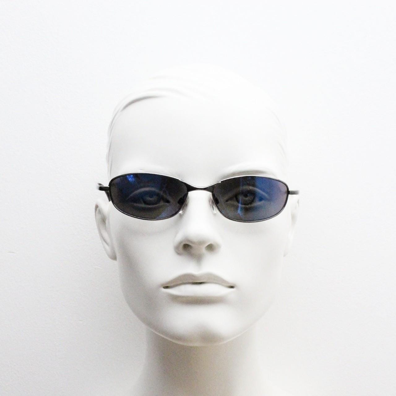90s vintage oval small bug eye sunglasses. Curved grey chrome finish solid metal frame with blackout mirror lenses. Quality NOS