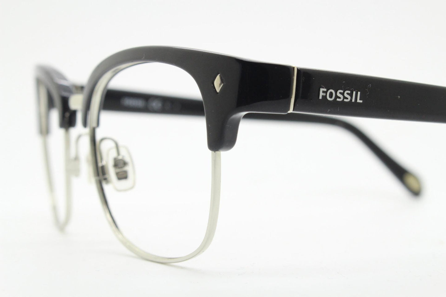 Fossil brow line eye glasses. Sharp and clean clubmaster format. Silver optical frames with black browline. Prescription eyeglasses. RX