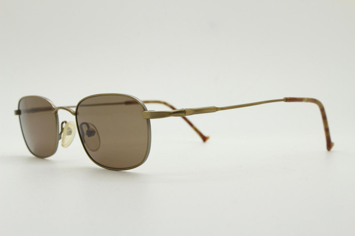 90s vintage small rectangular low profile metal sunglasses. Minimal slim frame in satin bronze finish with plain brown lenses. NOS. BNWT