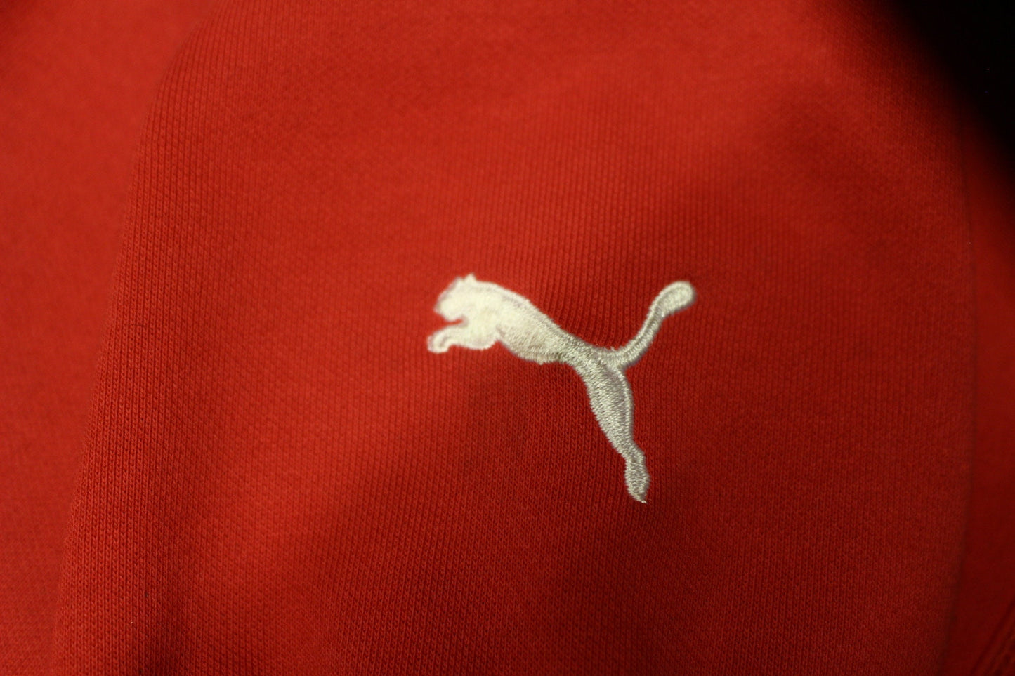 Puma red hoody with big chest logo. Unisex sports pullover sweatshirt with front muffler pockets. UK size L