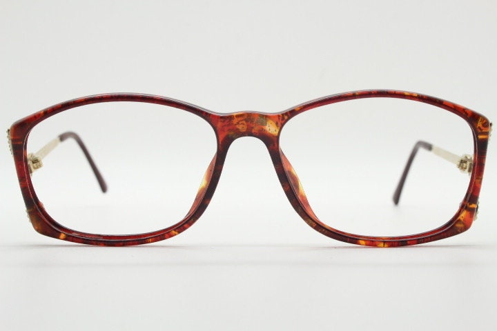 Christian Dior 80s vintage rectangular eye glasses made in Germany from Optyl. Striking marbled amber acetate optical frame. Prescription RX