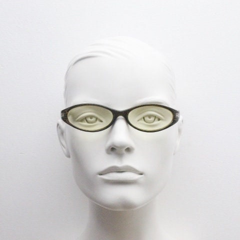 90s vintage abstract oval sunglasses. Thick curve around black frame with psychedelic yellow crackle print. Mini mask. Cosplay NOS