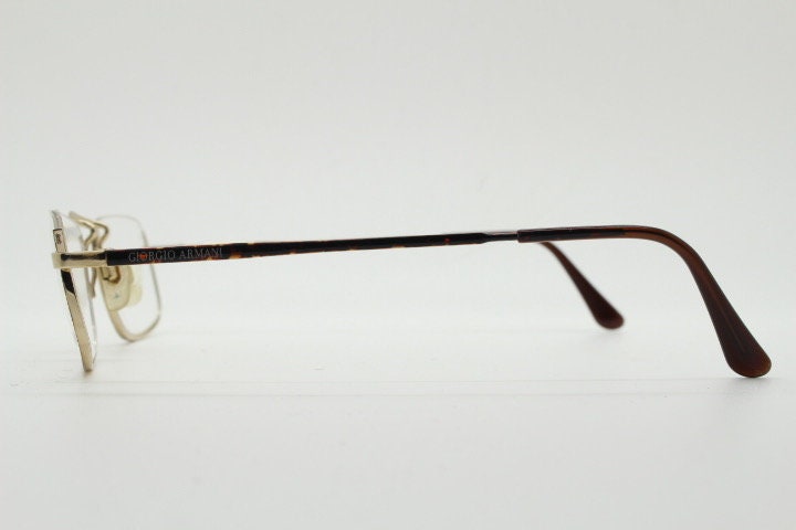Giorgio Armani rectangular eye glasses made in Italy. Half frame underwire with metallic tortoise enamel. Prescription optical eyeglasses RX