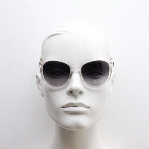 Dolce and Gabbana oversized cateye sunglasses model 4211. Womens transparent cat eye with cut-out florid metal arms and smoky lenses. NOS
