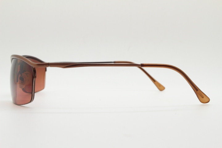 Y2K vintage curved rectangular sunglasses. Minimal half frame brow line design in brown satin finish with mid tone lenses. 2000's. 00's NOS