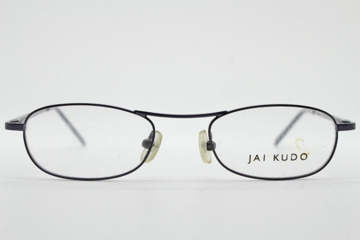 Jai Kudo 90s vintage oval eye glasses. Small low profile optical frames in charcoal grey chrome. Prescription eyeglasses. RX Spectacles