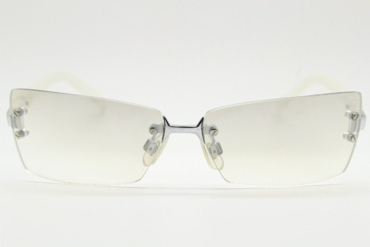 Y2K vintage  frameless sunglasses. Minimal light tone curved mirrored lenses with white frosted arms. 2000's. 90s. 00s. NOS