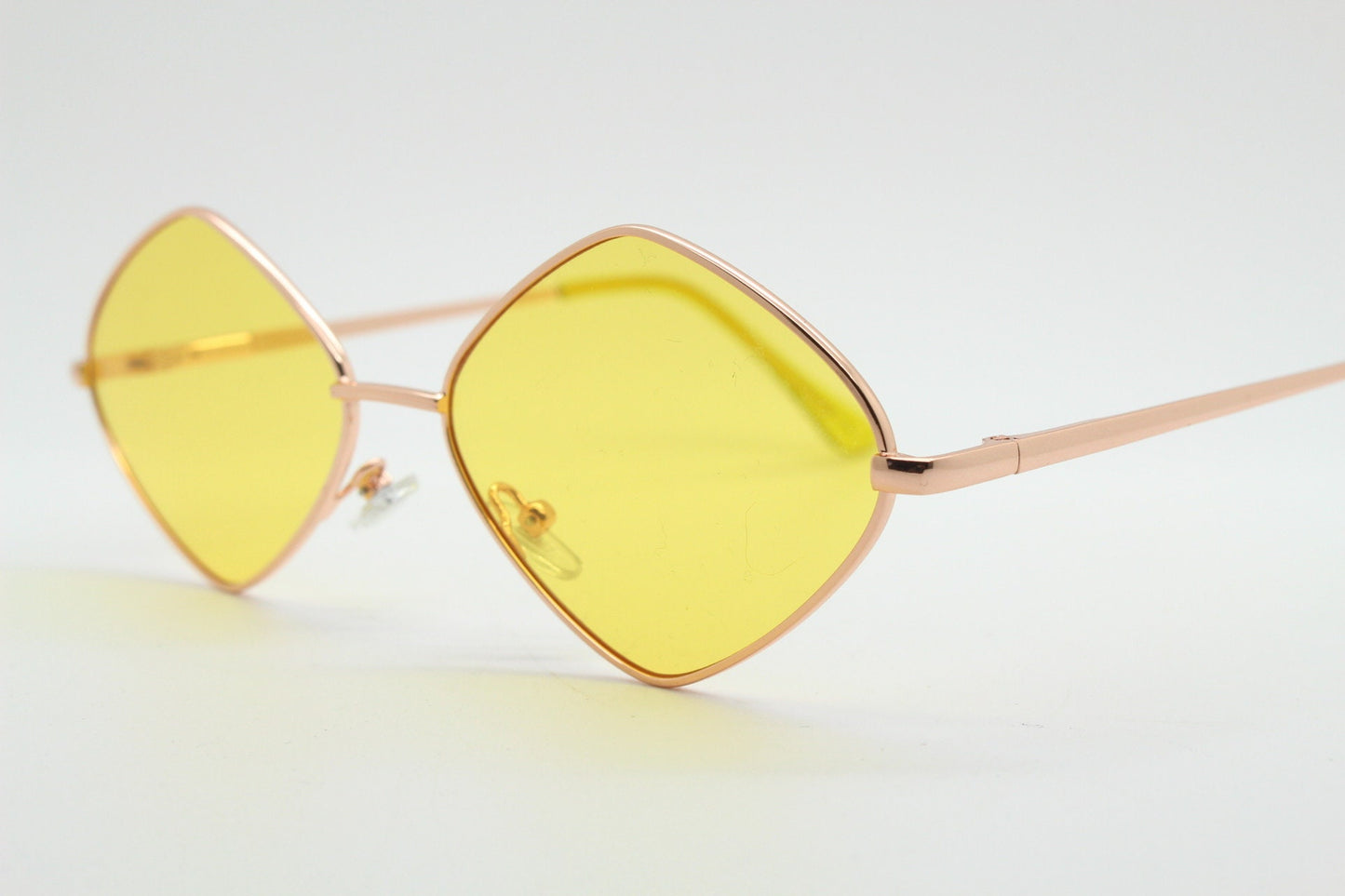 90s vintage diamond sunglasses. Minimal rose gold frame with psychedelic mod style yellow lenses. Unused BNWT