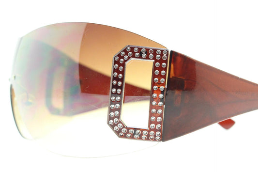Y2K vintage visor sunglasses. 2000's brown wraparound mono lens shield design with big diamante effect crest. 00s uber fashion mini mask NOS