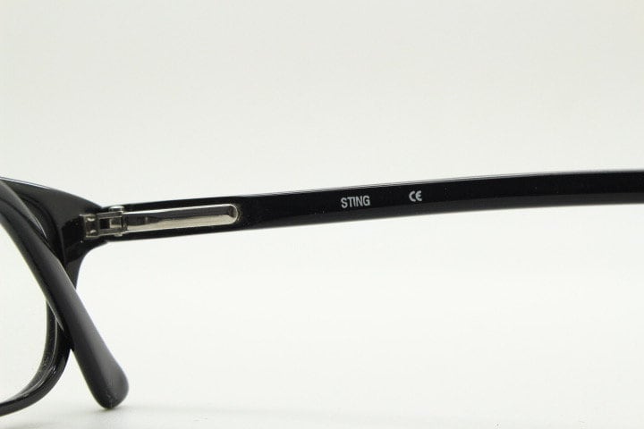 Sting 90s vintage rectangular eye glasses made in Italy. Plain black gloss low profile acetate optical frames. Prescription RX. NOS