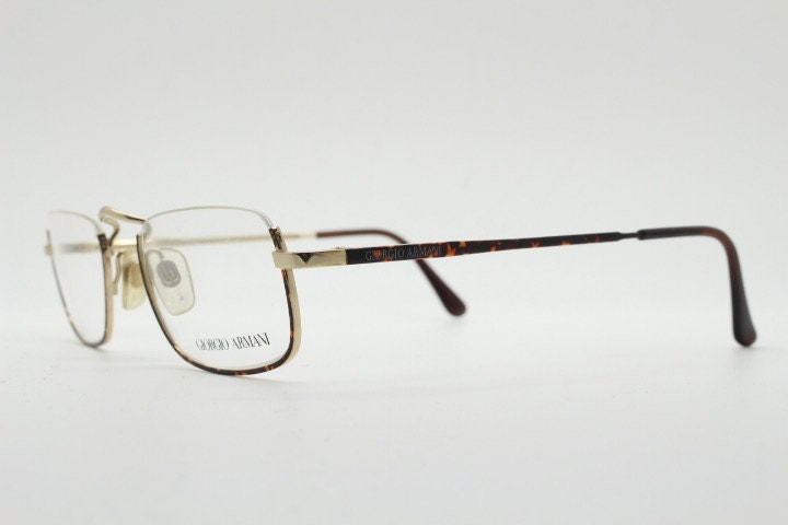 Giorgio Armani rectangular eye glasses made in Italy. Half frame underwire with metallic tortoise enamel. Prescription optical eyeglasses RX