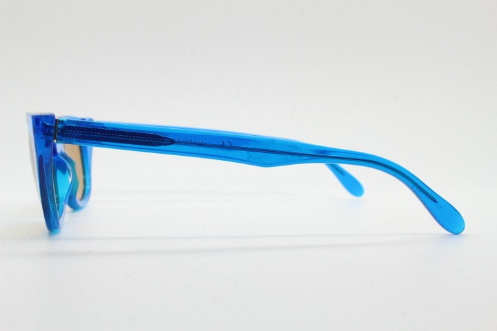 Retrosuperfuture thick cat eye sunglasses hand made in Italy. Intense blue acetate chunky frame with contrasting brown lenses. BNWOT