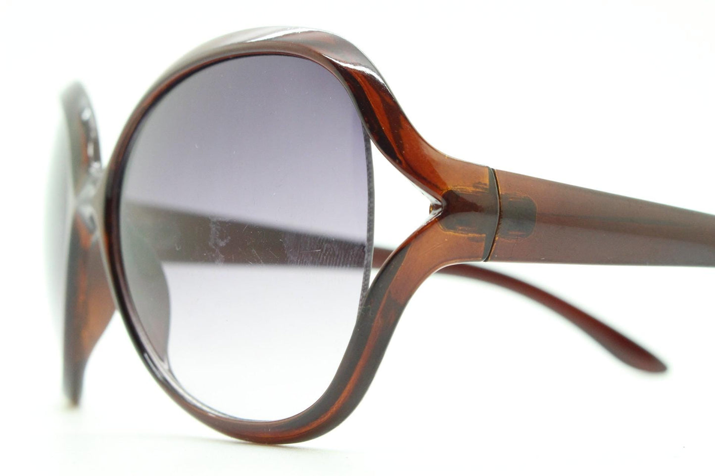 Y2K vintage big round angular sunglasses. Women's 70s design in transparent brown with graduating lenses and forked side detail. 2000s NOS
