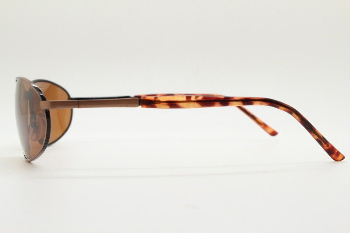 Y2K vintage small bug eye aviator sunglasses. Curved copper brushed finish solid metal frame with tortoise arms. Unused 2000s NOS