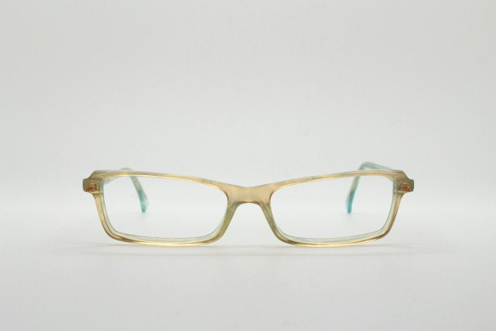 Alain Mikli rectangular eye glasses hand made in France. Low profile slim peach and blue transparent acetate optical frame. Prescription RX.