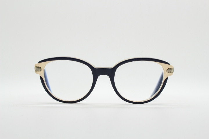 Nina Ricci vintage cat eye glasses. Yellow crystal and black acetate cateye optical frames gold metal arms. Womens prescription spectacles