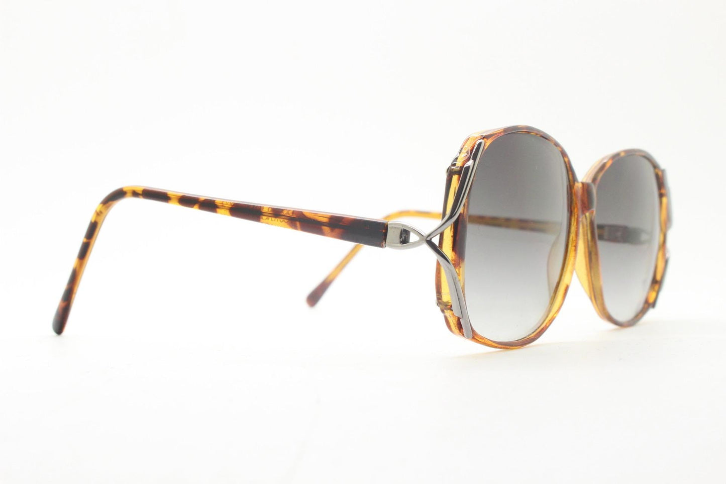 80s vintage square sunglasses. Womens honey tortoise frame with dynamic metal  forked side joints and graduating lenses. 70s. Unused NOS